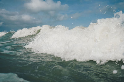 Close-up of wave splashing on sea