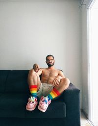 Young man sitting at home