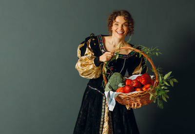 Portrait of young woman holding bouquet