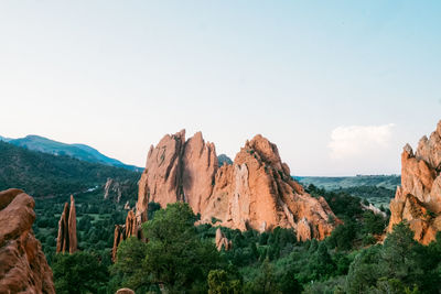 Panoramic view of rocks and sea against sky