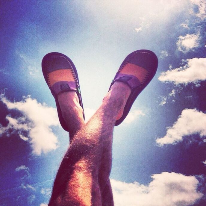 sky, cloud - sky, person, personal perspective, low angle view, part of, low section, cloud, lifestyles, leisure activity, blue, cloudy, unrecognizable person, human finger, outdoors, human foot