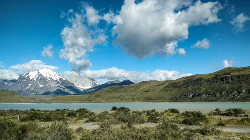 Scenic view of mountains against cloudy sky