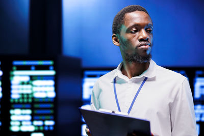 Side view of man using laptop
