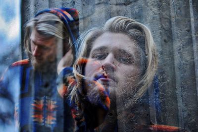 Close-up of young blond man