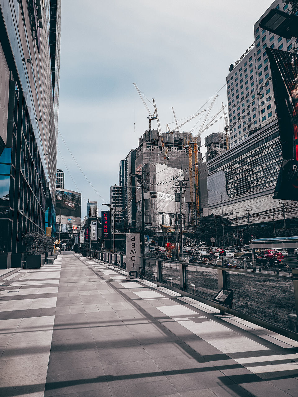 building exterior, architecture, built structure, city, transportation, street, road, sky, building, nature, mode of transportation, incidental people, city street, day, motor vehicle, land vehicle, road marking, car, outdoors, cloud - sky, office building exterior, skyscraper