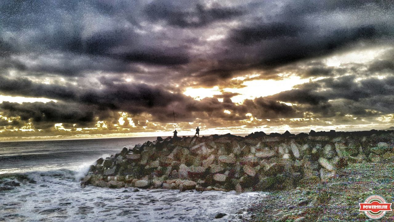 sky, sea, cloud - sky, water, cloudy, scenics, horizon over water, beauty in nature, storm cloud, weather, tranquil scene, beach, overcast, sunset, tranquility, shore, nature, dramatic sky, rock - object, cloud