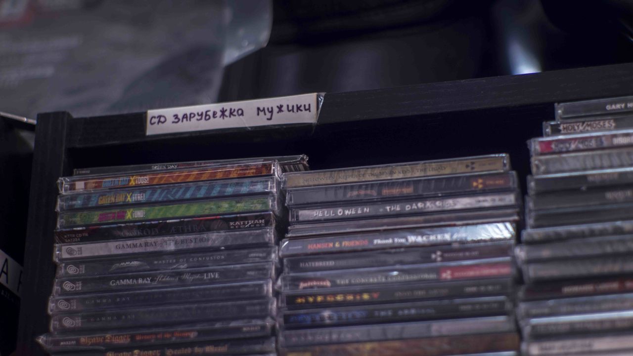 CLOSE-UP OF BOOKS IN SHELF