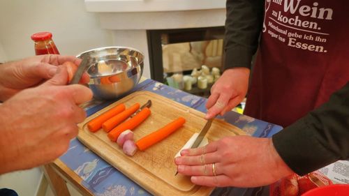 Close-up of man preparing food on cutting board