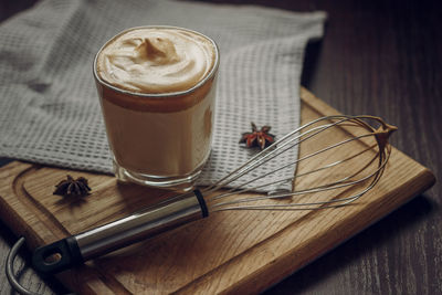 A glass of the popular trendy drink dalgona coffee with milk. whisk and ice. high quality photo