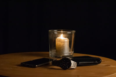 Close-up of coffee on table against black background