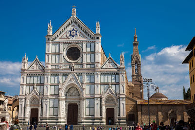 Tourists at the basilica of the holy cross in florence