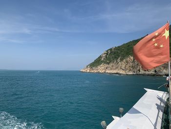 Scenic view of sea against blue sky