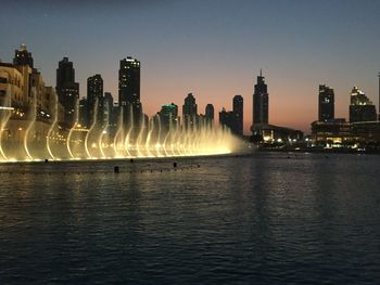 Panoramic view of illuminated buildings against clear sky