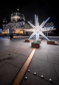 Illuminated building in city at night