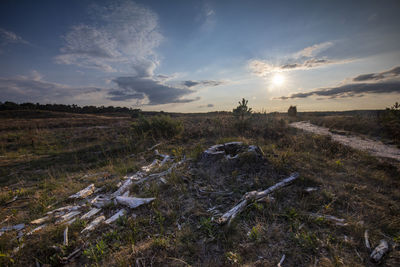 Scenic view of land against sky during sunset