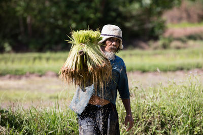 Full length of man standing on field