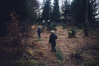 Family hiking in forest