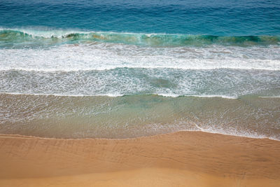 High angle view of surf on beach