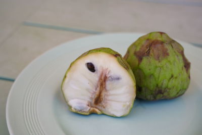 High angle view of fruit in plate on table