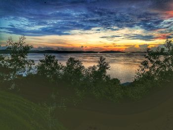 Scenic view of lake against sky during sunset