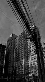 Low angle view of buildings against sky in city