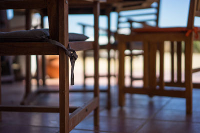 Close-up of empty chairs on table