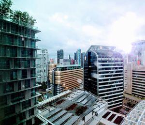 Modern buildings in city against sky