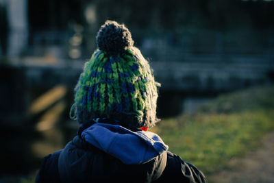 Rear view of man wearing knit hat during winter