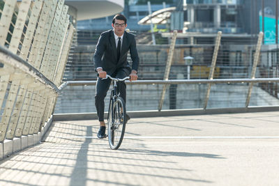 Man riding bicycle in city