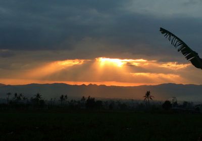 Scenic view of landscape against sky during sunset