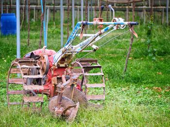 Old rusty wheel on field