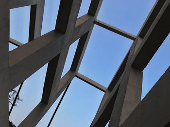Low angle view of bridge against clear blue sky