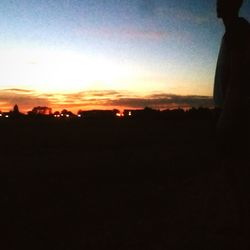 Silhouette landscape against sky during sunset