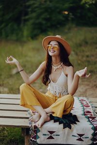 Young woman sitting on bench