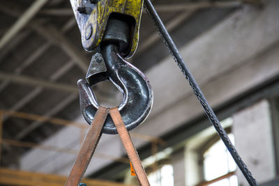 Low angle view of hook at metal industry