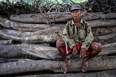 Portrait of a smiling man sitting outdoors