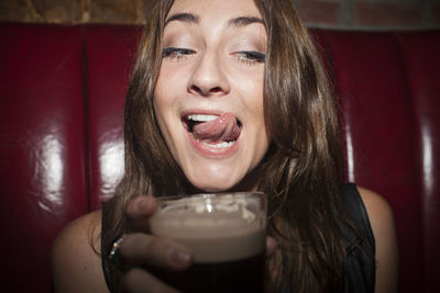 Young woman enjoying a drink