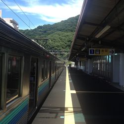 Train on railroad station platform against sky