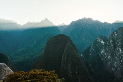 World heritage site machu picchu in peru at sunrise with sunrays on the mountain