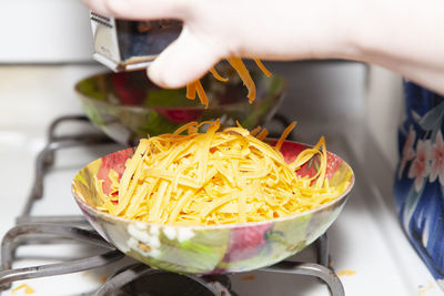 Close-up of person preparing food