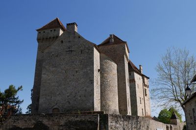 Low angle view of bell tower against sky