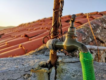 Close-up of rusty metal against wall