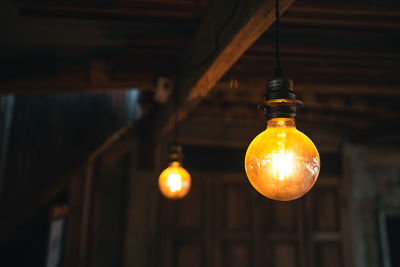 Low angle view of illuminated light bulb