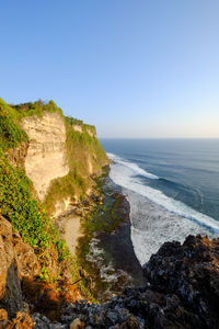 Scenic view of sea against clear blue sky