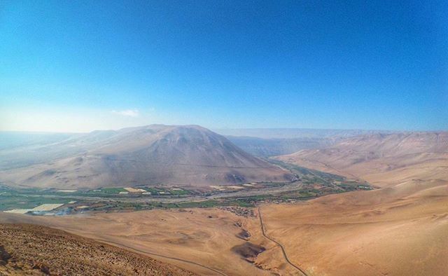 tranquil scene, landscape, tranquility, desert, scenics, mountain, arid climate, beauty in nature, sand, clear sky, blue, nature, barren, copy space, mountain range, non-urban scene, remote, physical geography, sand dune, geology