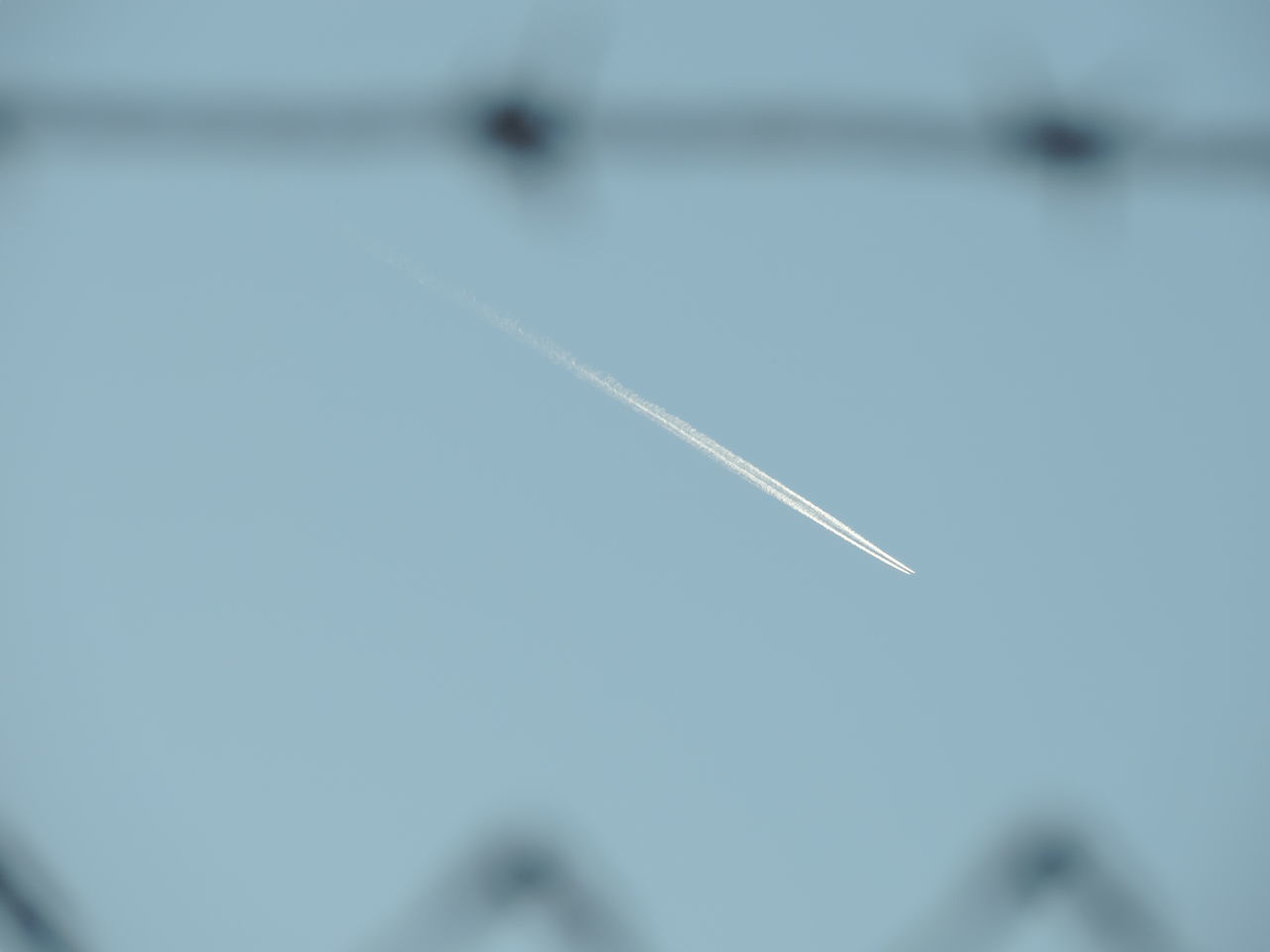 CLOSE-UP OF AIRPLANE AGAINST CLEAR SKY
