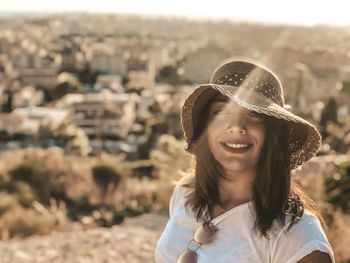 Portrait of smiling woman wearing hat