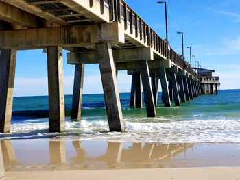 Pier over sea against sky