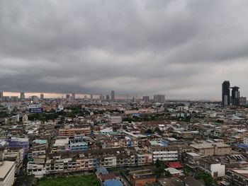 High angle view of buildings in city against sky