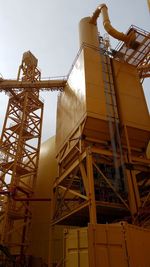 Low angle view of construction site against sky